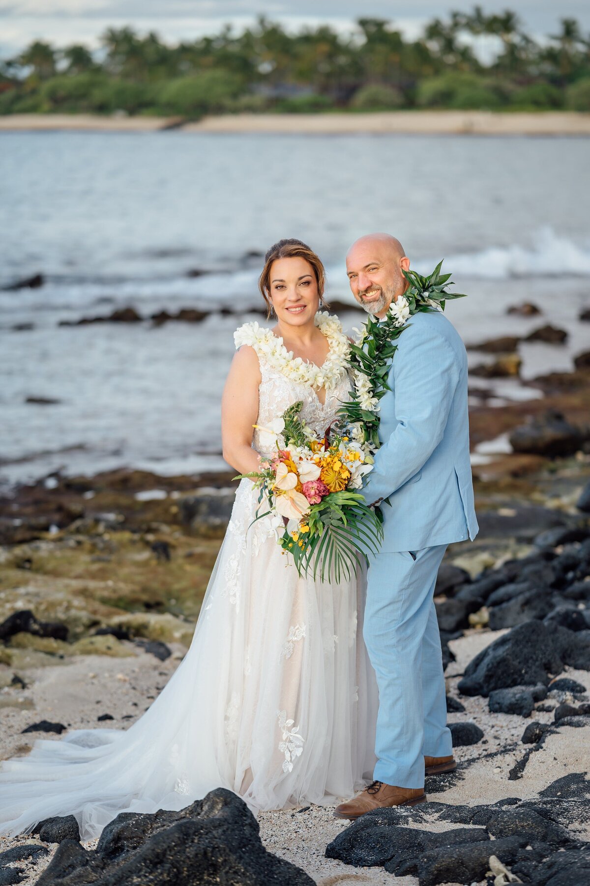 beautiful bride and groom smiling at the camera