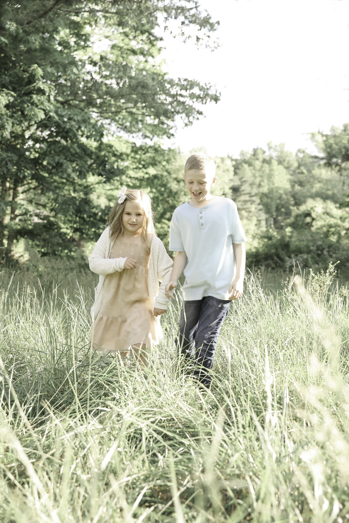 brother and sister holding hands
