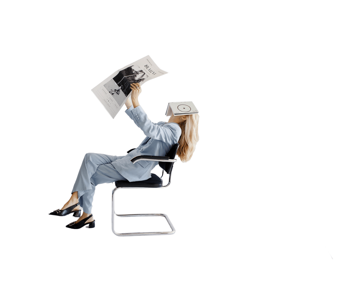 Woman sitting in chair holding a newspaper