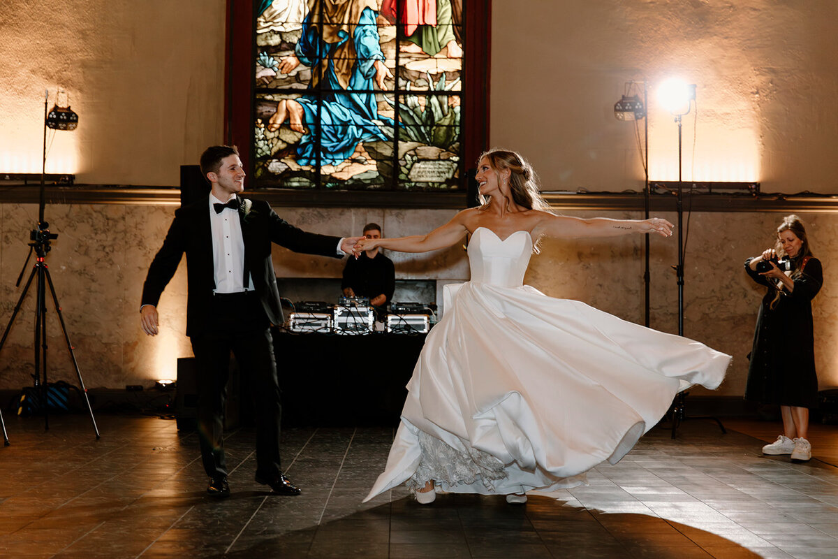 bride and groom standing together smiling