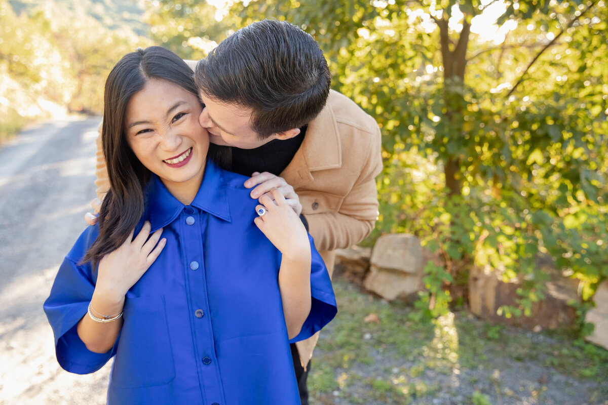 Husband walks wife during anniversary photography session