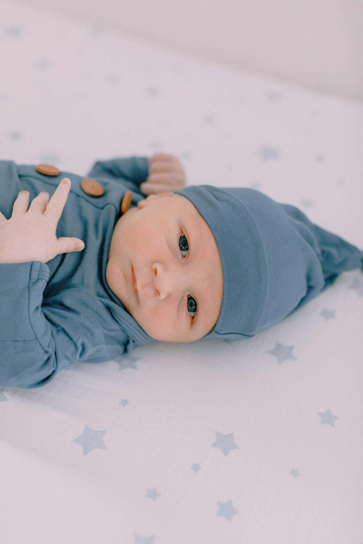 newborn baby looking at the camera