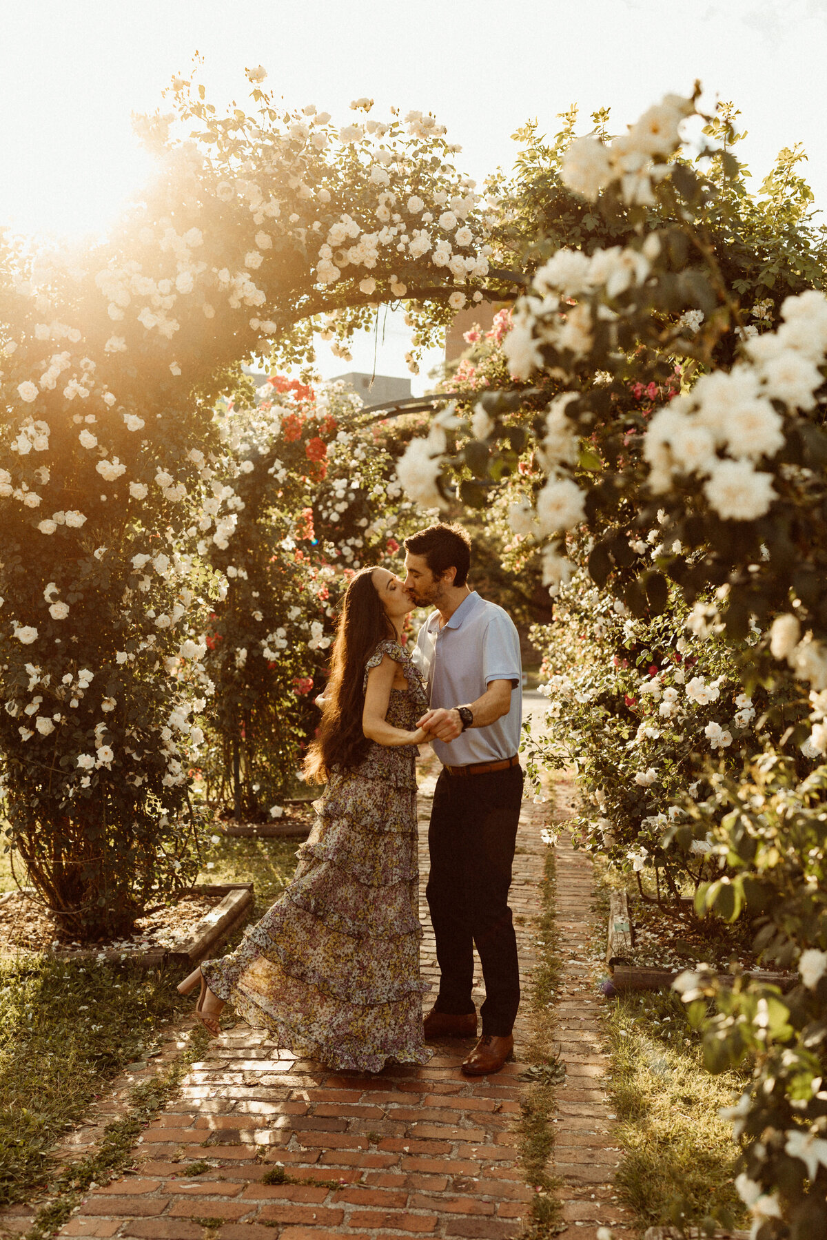 couple kisses at Thornden Park Rose Garden