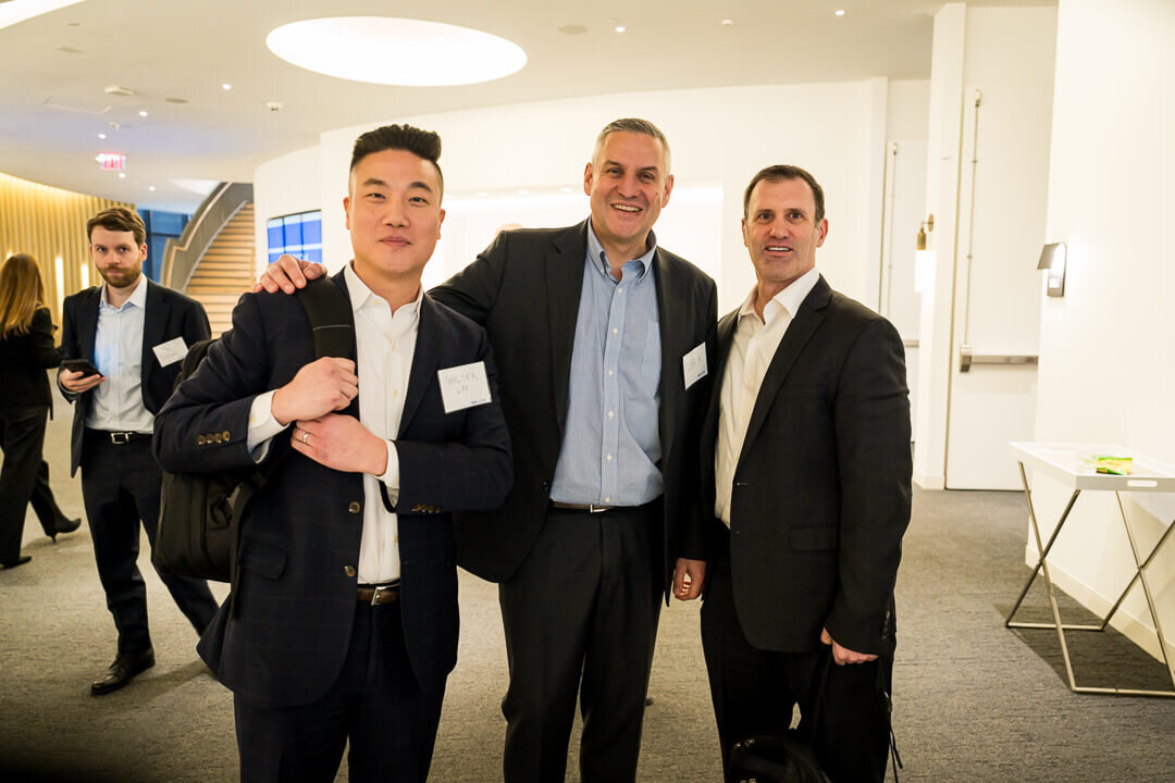 Corporate event photography of business professionals engaged in conversation during networking event new jersey.