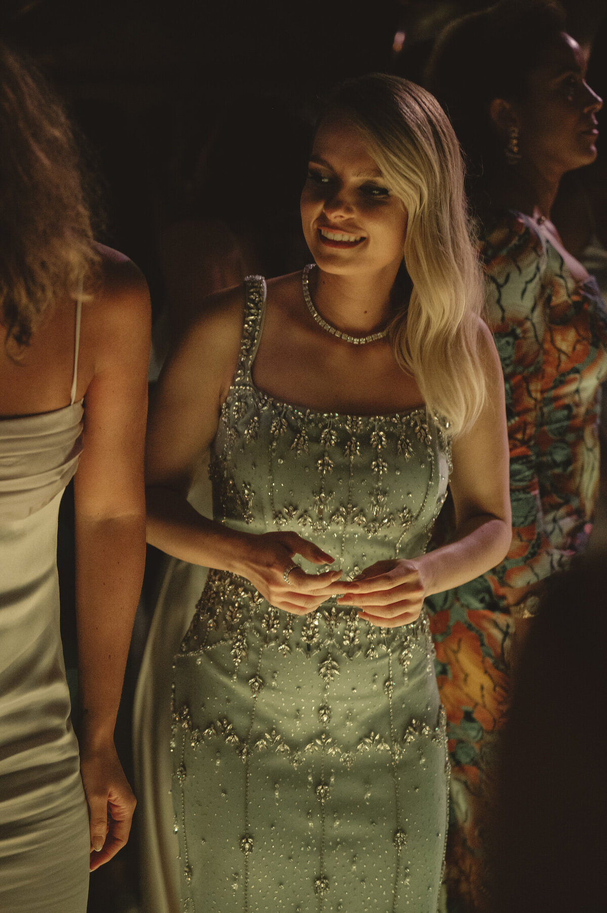 A guest at Quinta da Bellavista destination wedding using a black tie dress with ornaments