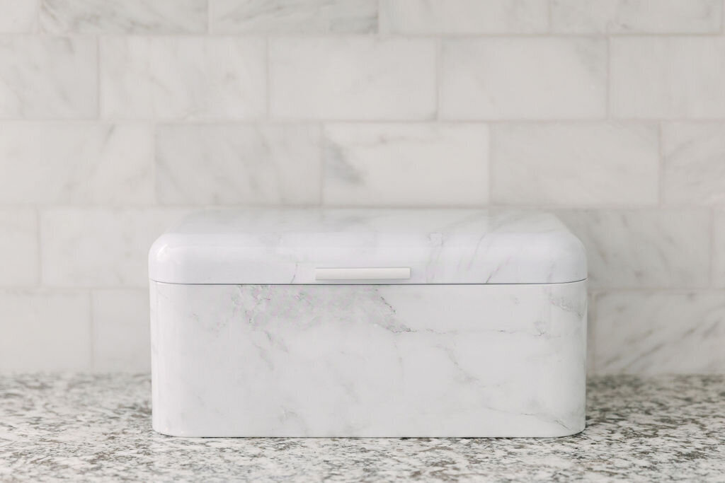 Use a countertop breadbox to store  vitamins and daily supplements