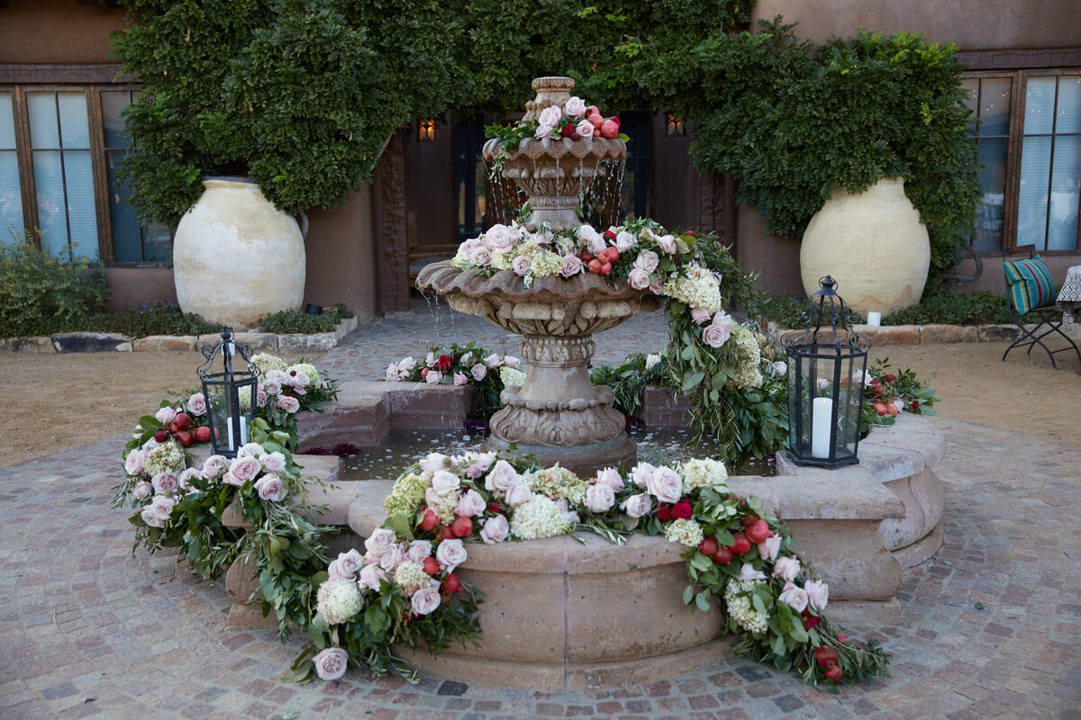 Florals in fountain at sante fe wedding