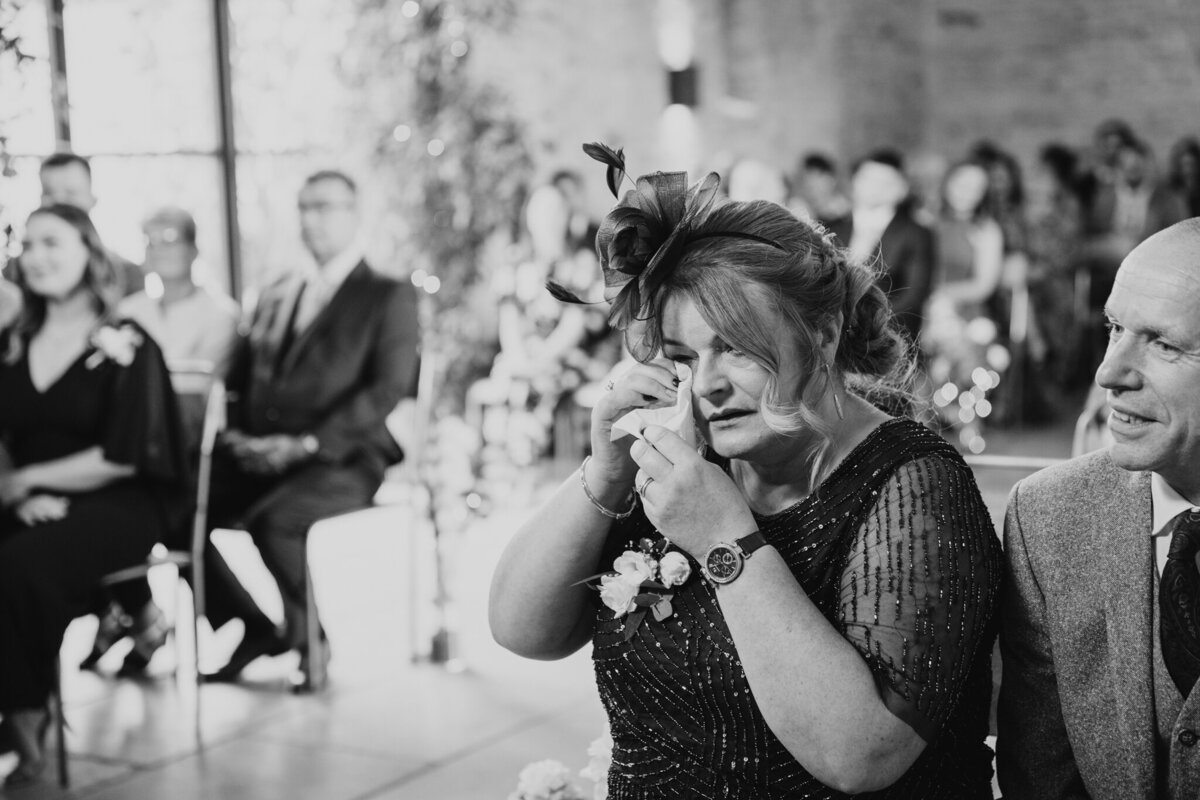 Emotional wedding guest during ceremony at Old Gore Yard Space