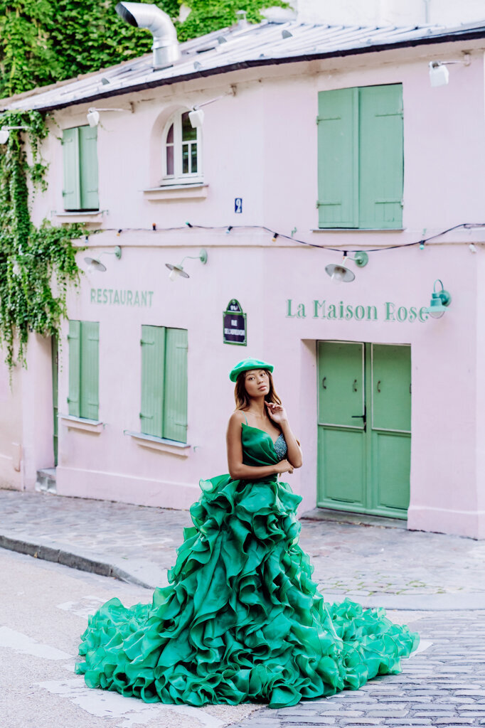 Portrait session at La Maison Rose Montmartre with Asian woman wearing dark green princess dress and matching beret