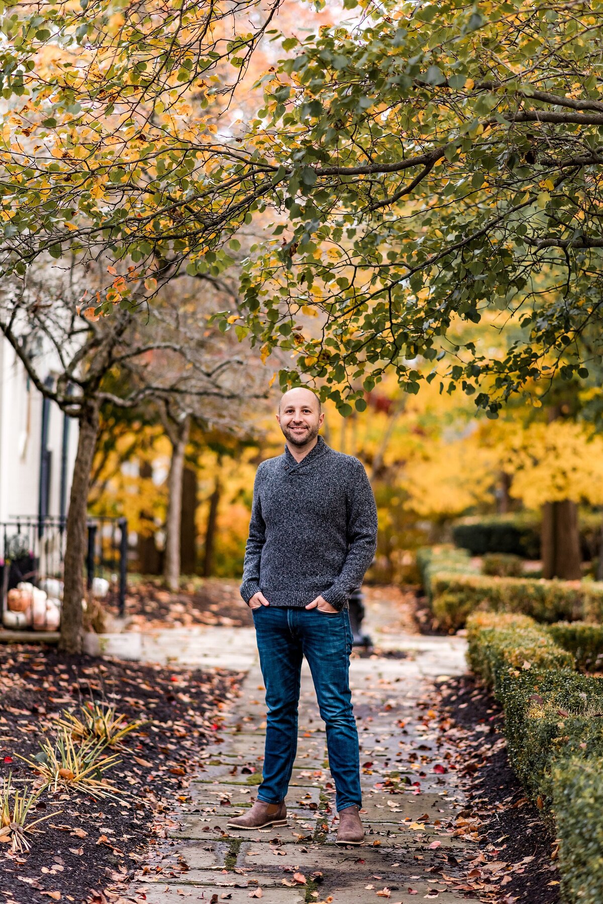 man standing on path in fall