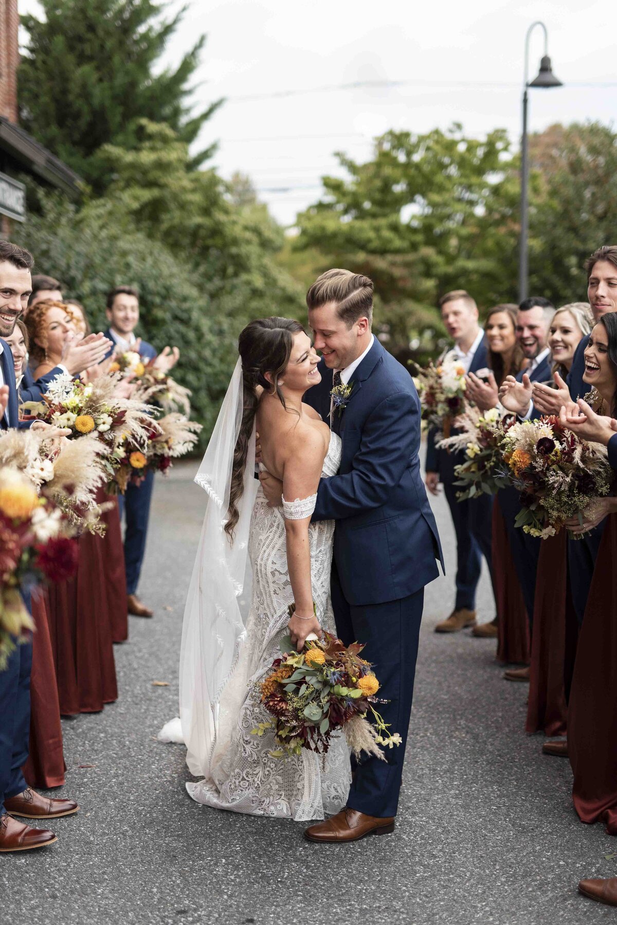 A bride and groom embracing at their wedding