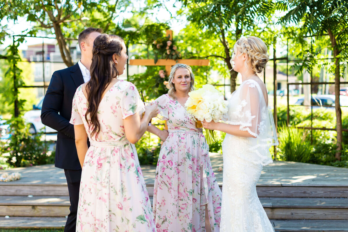 Bridesmaids chatting with bride at Fat Bottom Brewery wedding in Nashville, TN