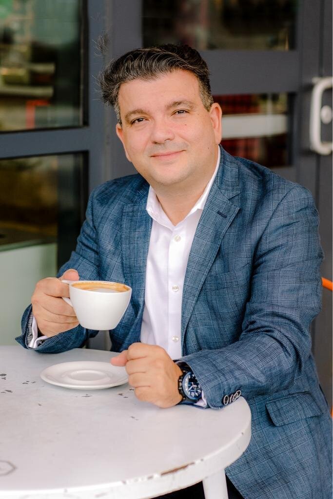 Salvatore with a coffee cup ideal for personal branding photos, coffee culture, and morning routines.