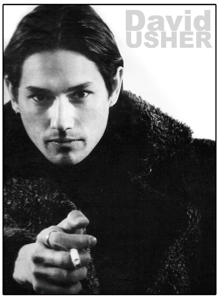 Magazine article featuring musician David Usher wearing faux fur coat holding cigarette pointing at camera  black and white publication MM