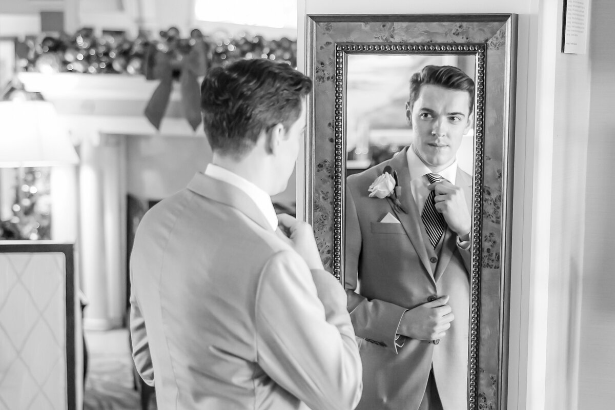 groom-using-mirror-to-get-ready
