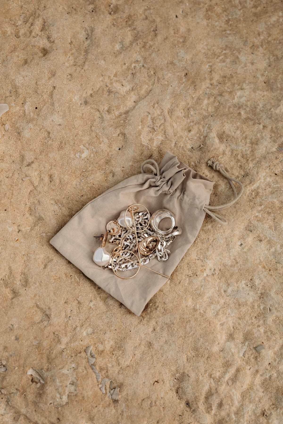 kaboompics_simplicity-by-the-sea-minimalist-jewelry-on-maltas-rocky-beach-31100