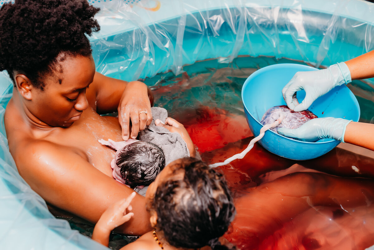 Mother births baby in water birth at home