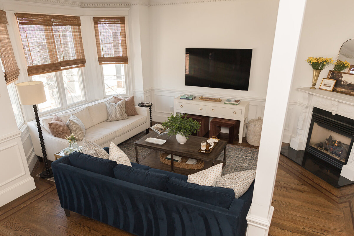 melinda chesson interiors boston living room with dark floors and blur and white couches