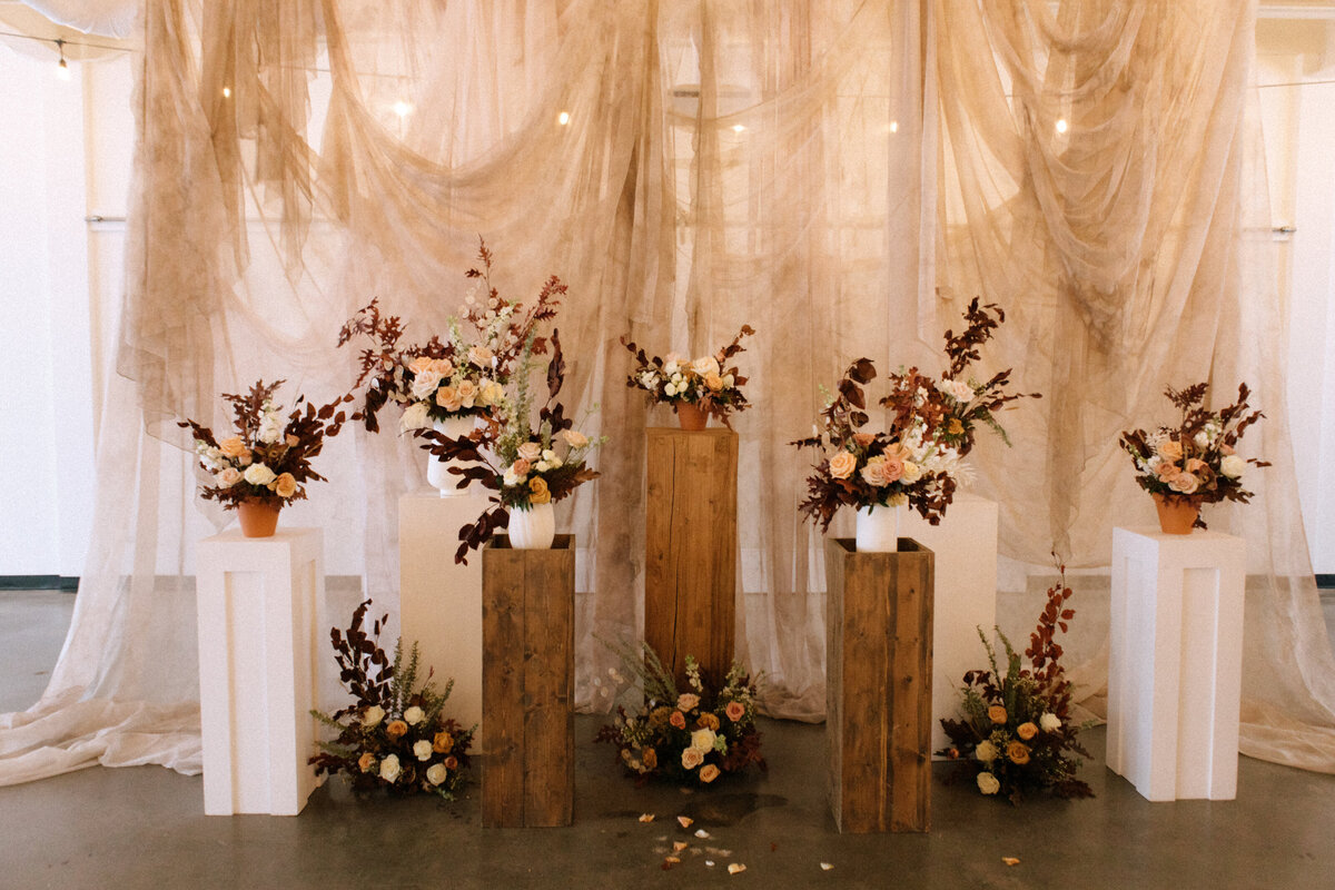 floral-pillar-fall-coloured-wedding-ceremony-designs-melissa-dawn