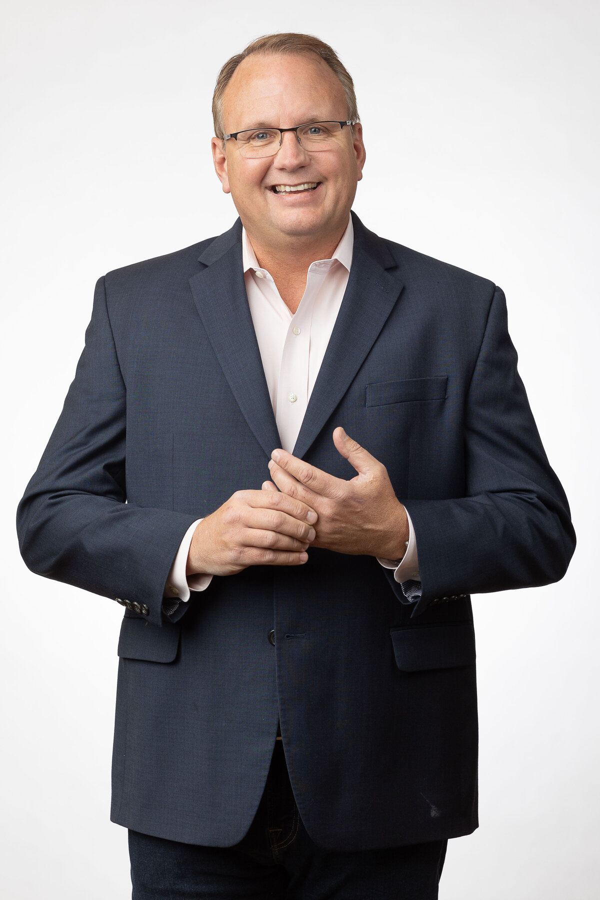 3/4 portrait of smiling CEO in a suit