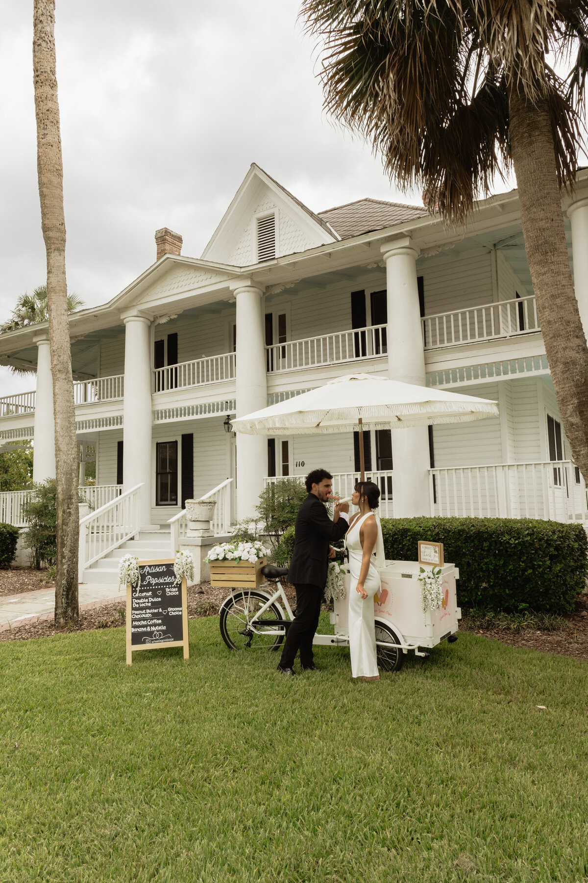 Charming pastel popsicle cart at a Florida wedding reception at The Palm Mansion