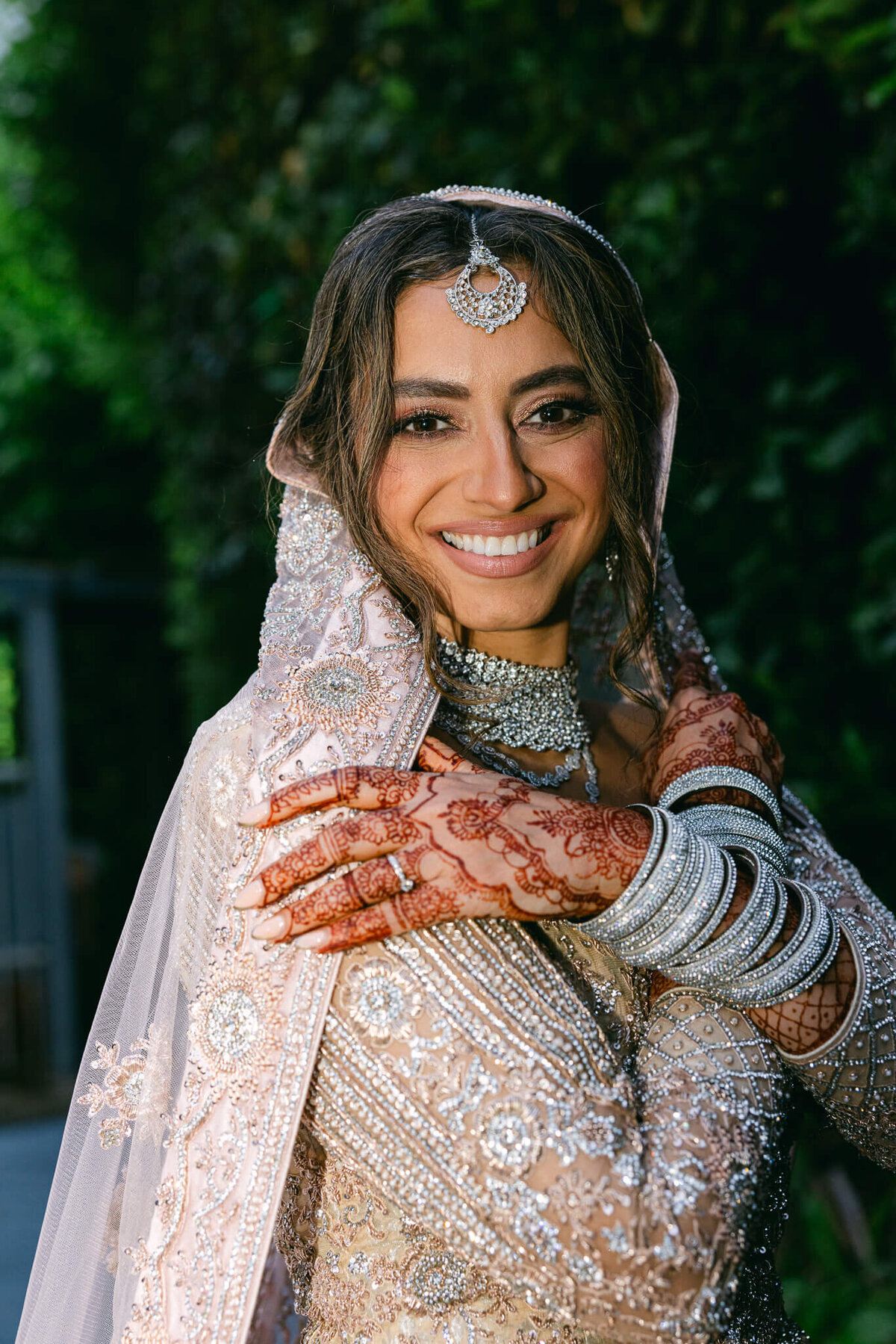 A wedding photo of the bride giving a big smile to the camera after her wedding ceremony in Dublin Ireland
