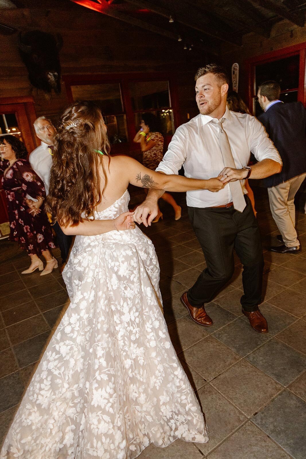 A bride and groom dance  the night away on their wedding day.
