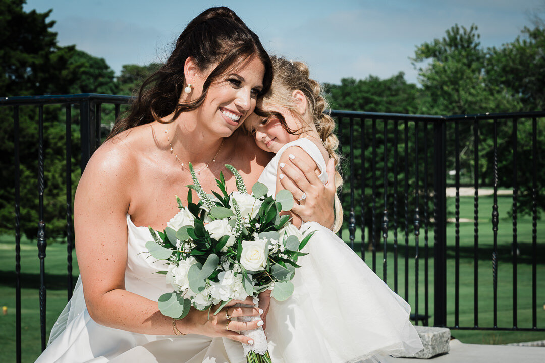 bride-hugging-flower-girl-nj-wedding-photo-by-alex-kaplan