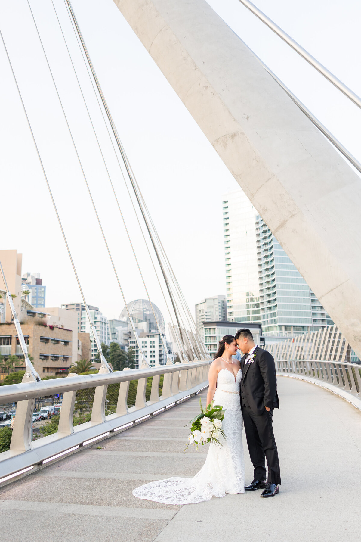 bride and groom on bridge downtown San Diego