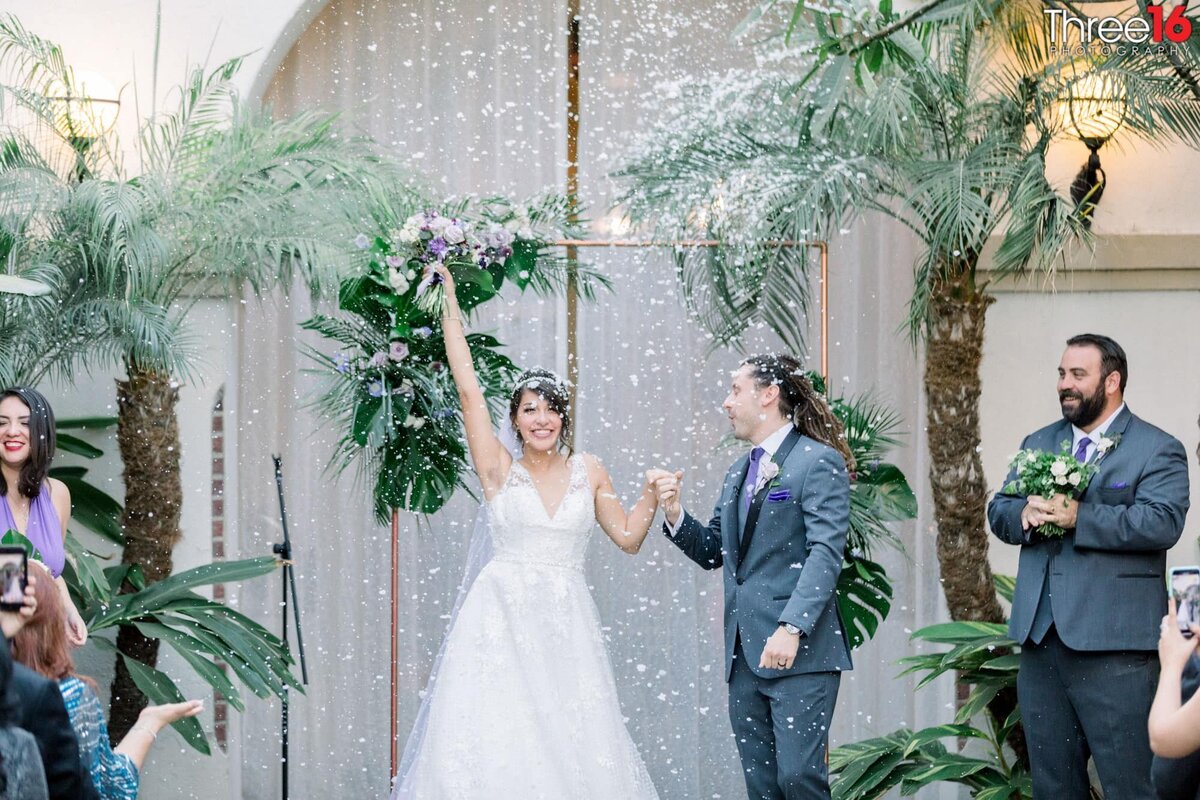 Bride cheers after being announced as married