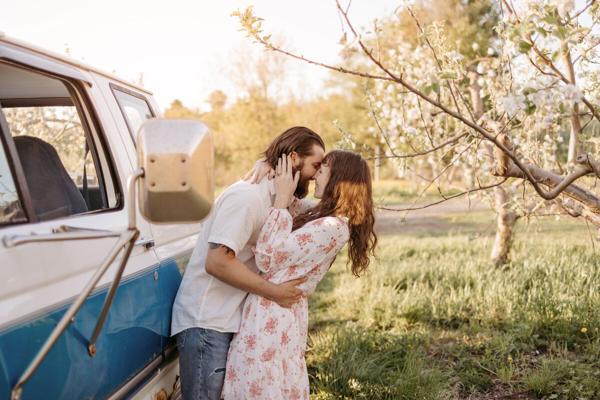 couple kissing by truck