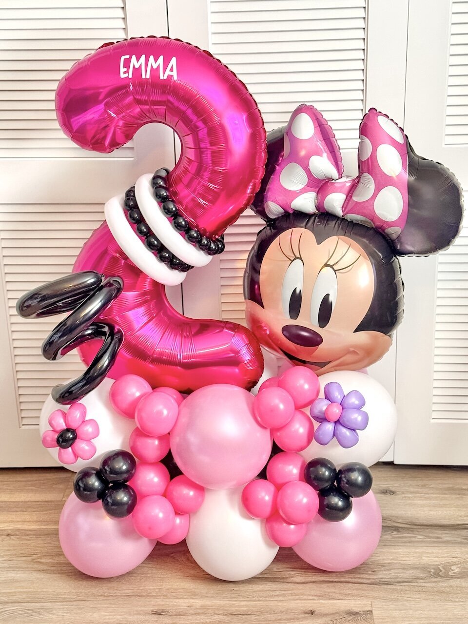 Minnie Mouse Balloon Bouquet with hot pink, light pink, black and white balloons for 2nd birthday.