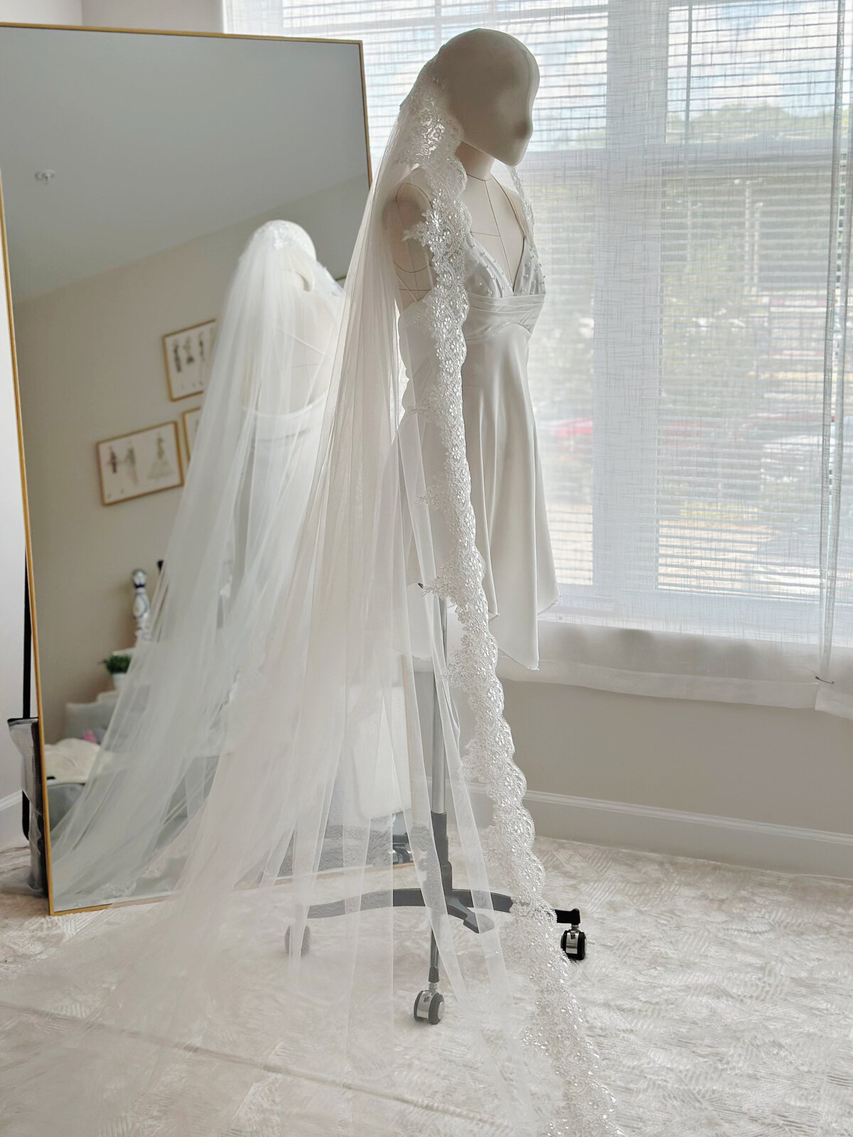 Bride wearing traditional Spanish mantilla veil with lace trim