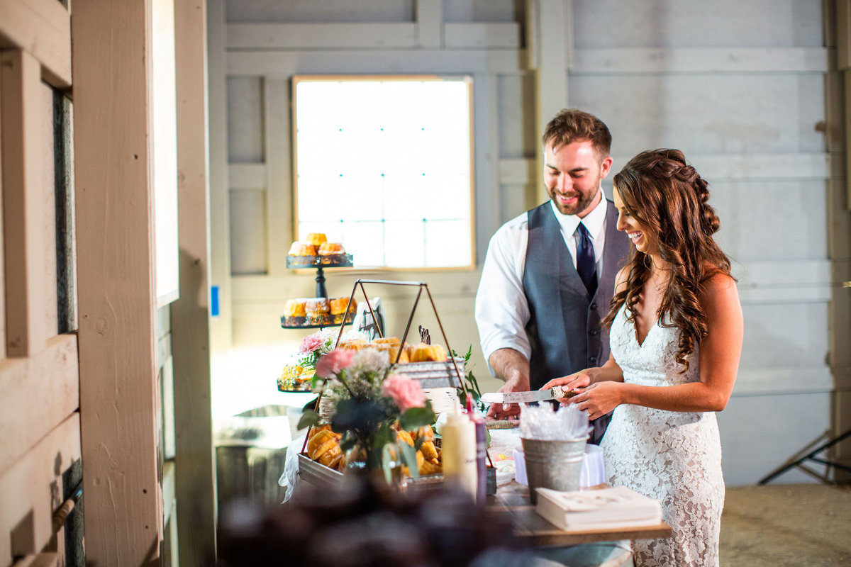 Strawberry-Creek-Ranch-Wedding-Ashley-McKenzie-Photography-Summer-love-on-the-ranch-Couple-cutting-the-cake
