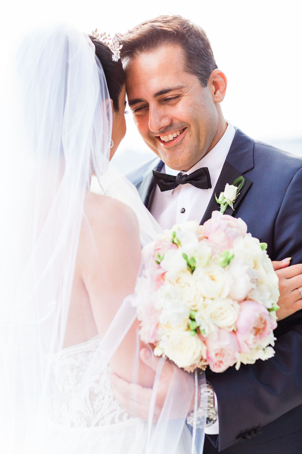 bride and groom laughing