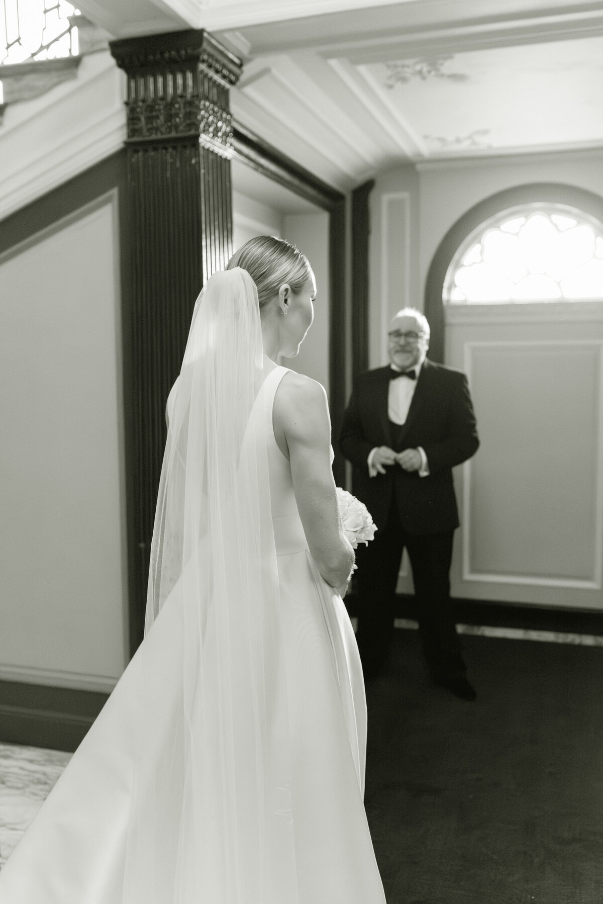 Emotive black and white image of a Father and daughter on the morning of her Gleneagles wedding.  Image by Scotland wedding photographer, Jill Cherry Porter.