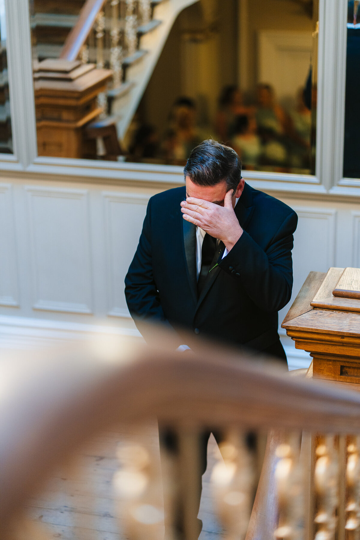 Brides father waiting to see his daughter in her dress for the first look takne by Anthony Horseman