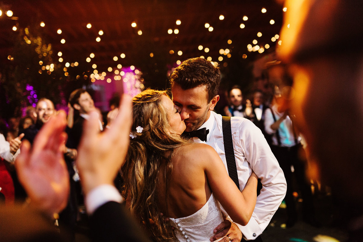 bride and groom kissing during their first dance