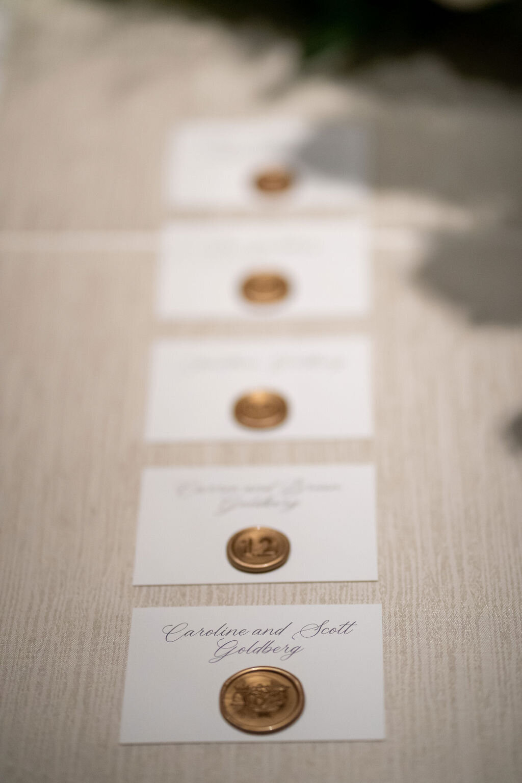 escort cards with calligraphy and wax seal