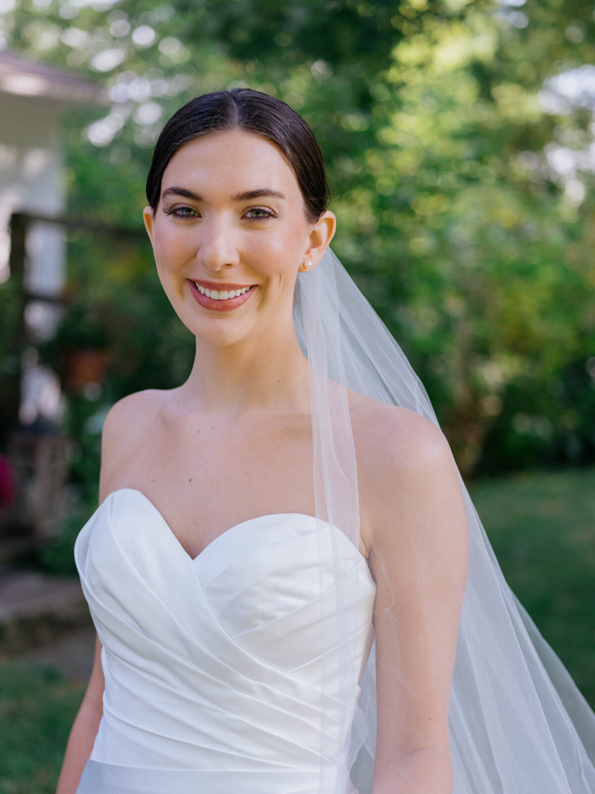 Bride in elegant Maggie Sottero gown at her backyard wedding
