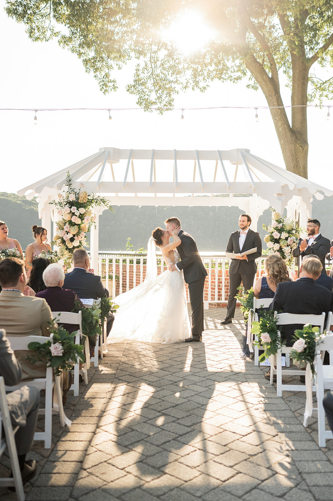 first kiss during summer wedding at the grandview, poughkeepsie, ny