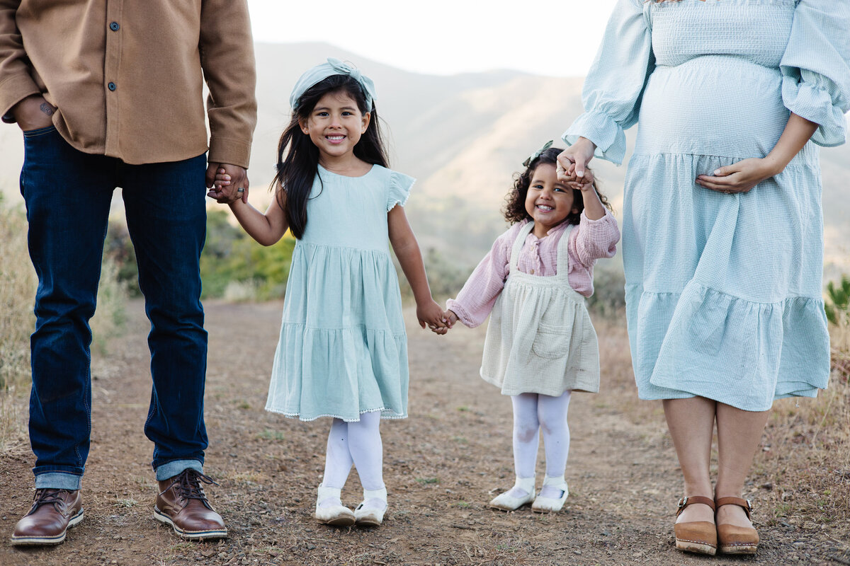 two girls, mom and dad maternity shoot
