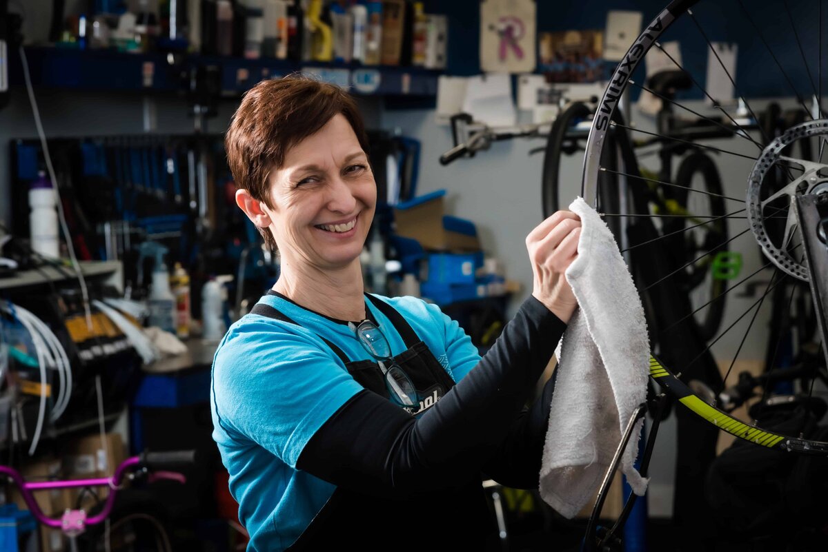 Woman working in a bike shop