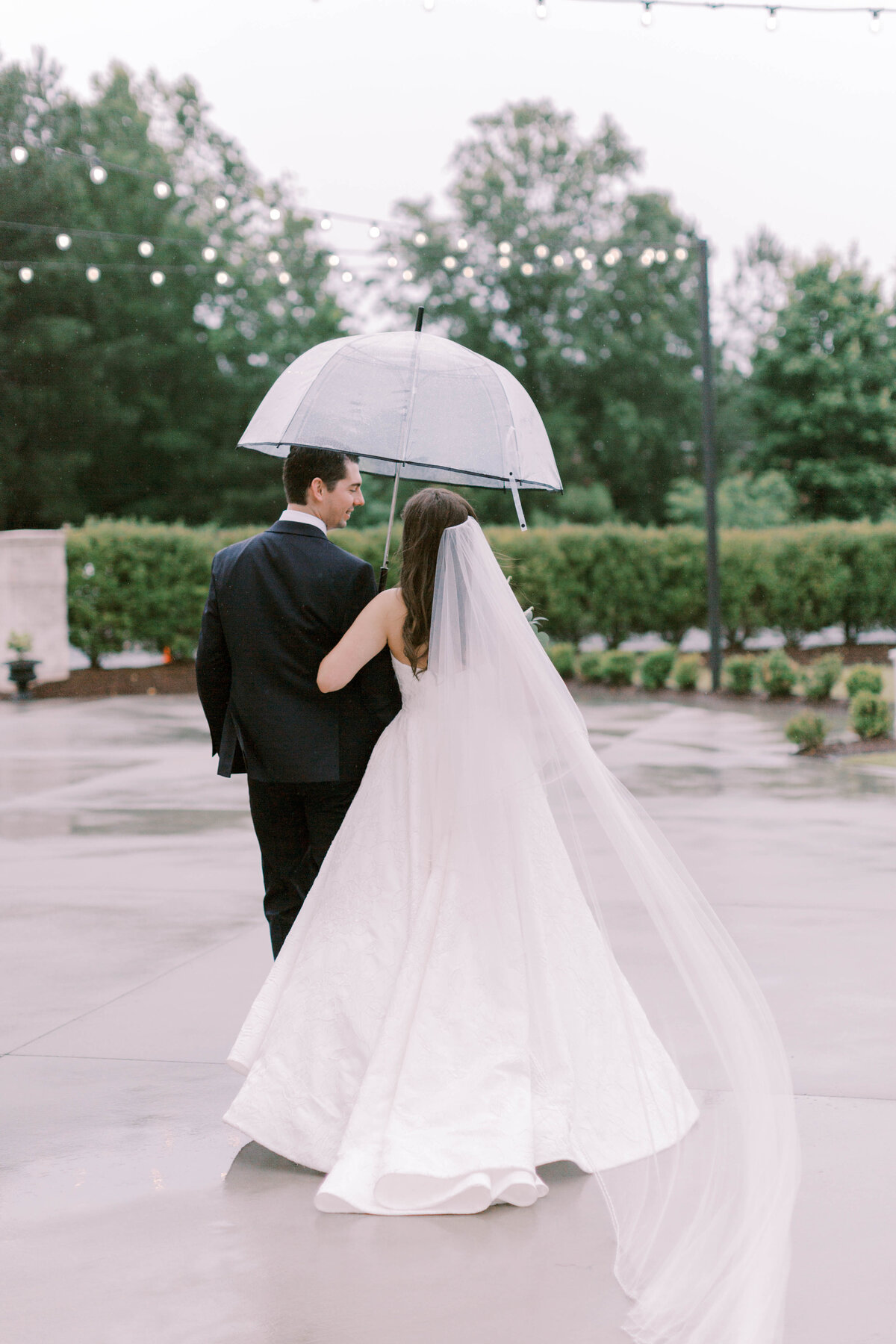 couple with umbrella on patio