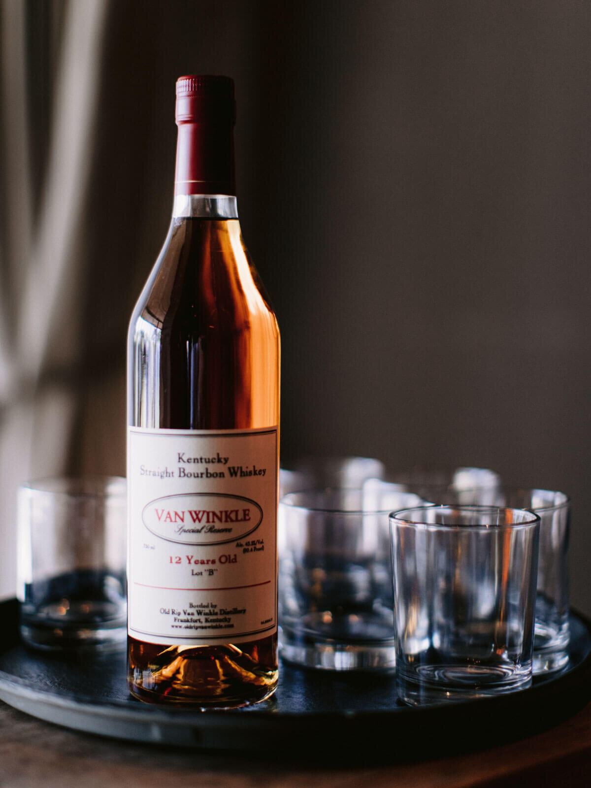 A bottle of whiskey and a few shot glasses for a wedding in Khayangan Estate, Uluwatu, Bali, Indonesia. Image by Jenny Fu Studio