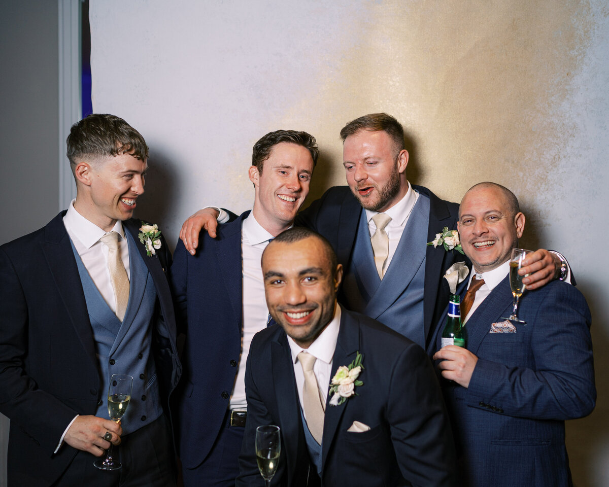 Groomsmen in wedding portrait studio wedding photobooth