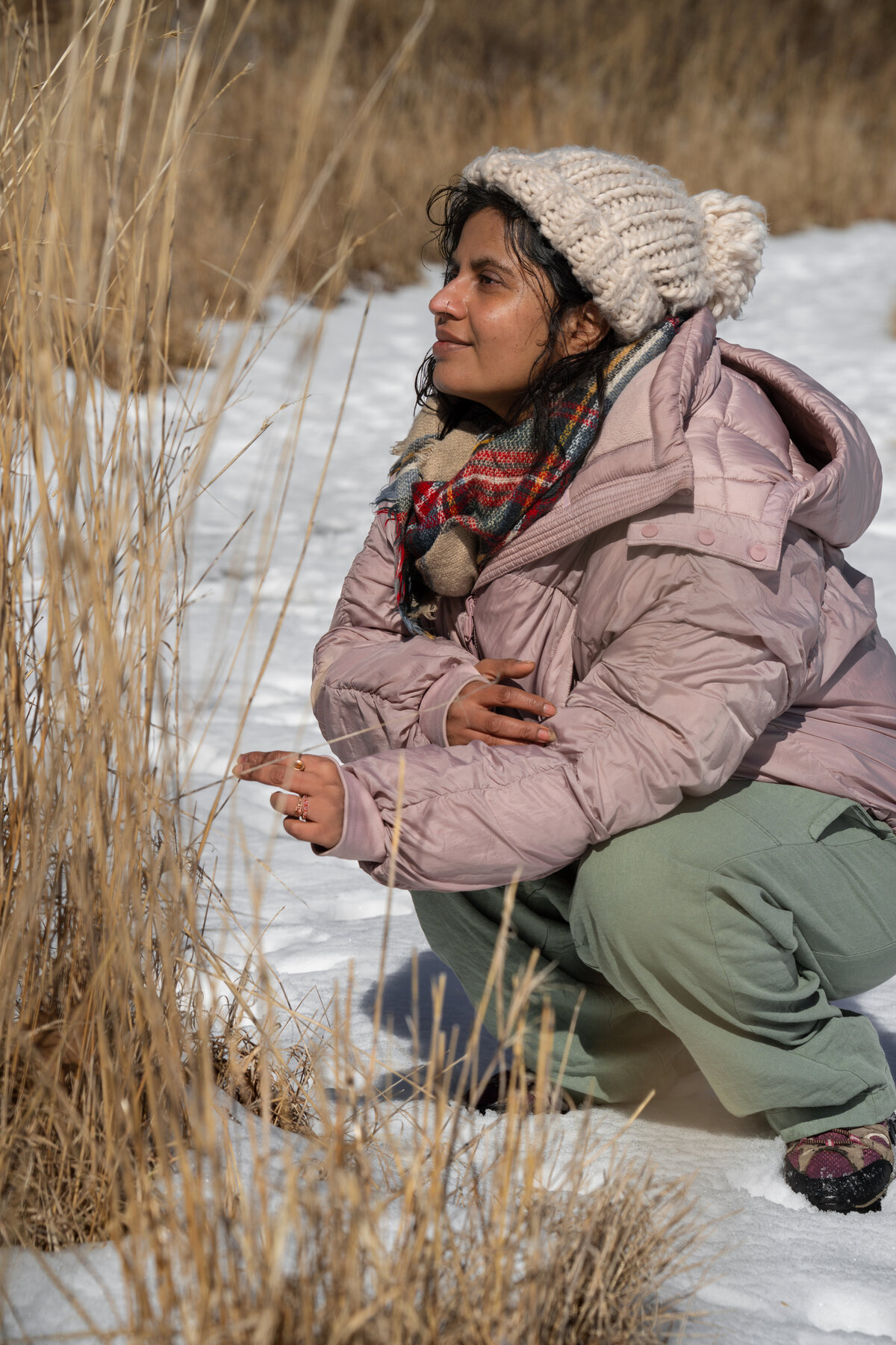 woman in winter field with snow 