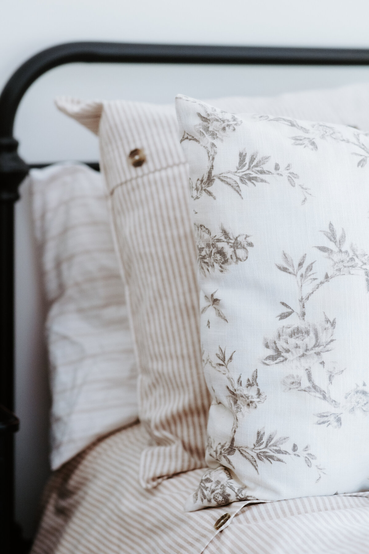 Pottery Barn and Studio McGee at Target pillows and bedding in the bedroom of the modern farmhouse overnight accommodations at Willowbrook wedding venue