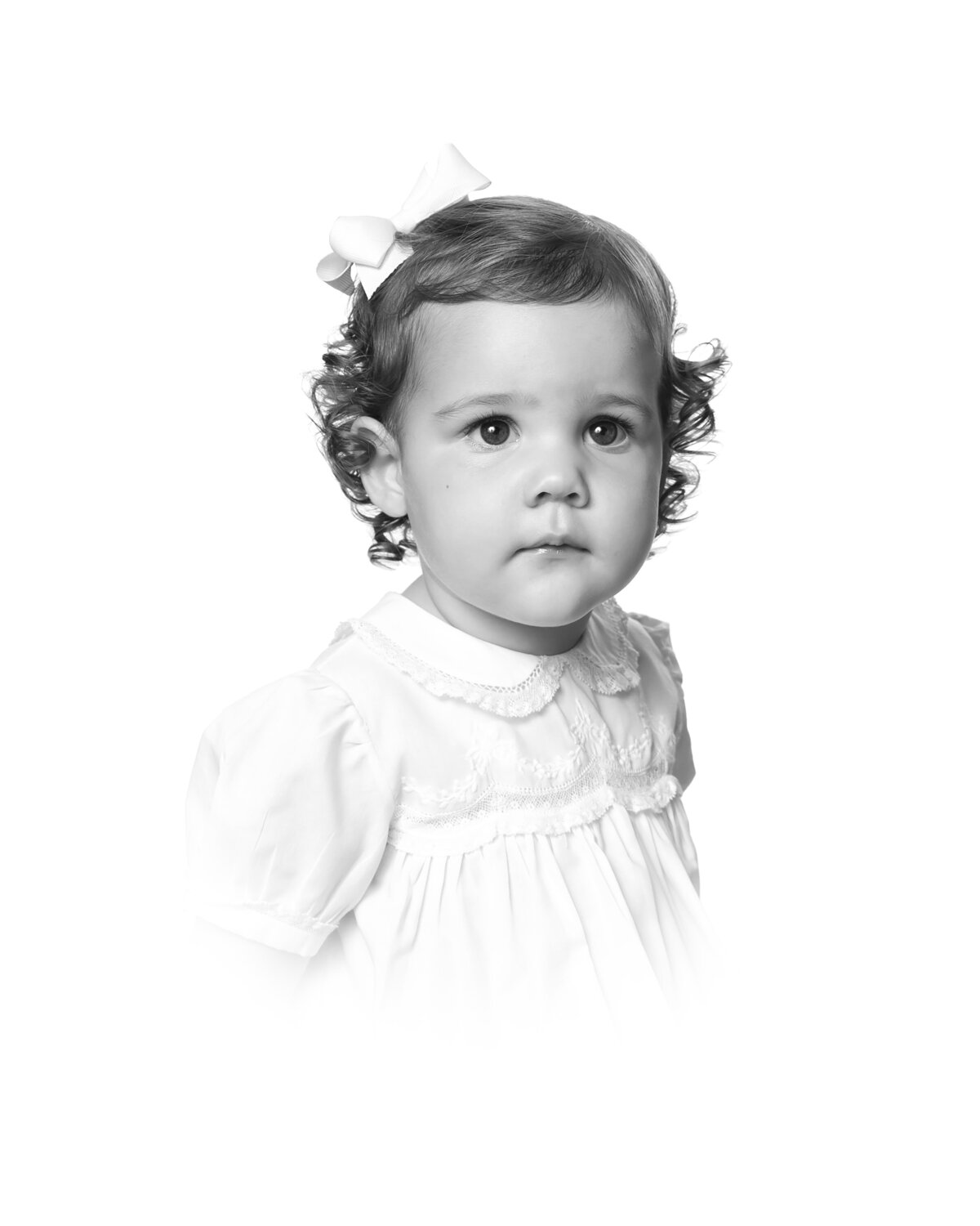 Classic heirloom portrait of a child in soft tones, showcasing the delicate and timeless nature of vintage portraiture.