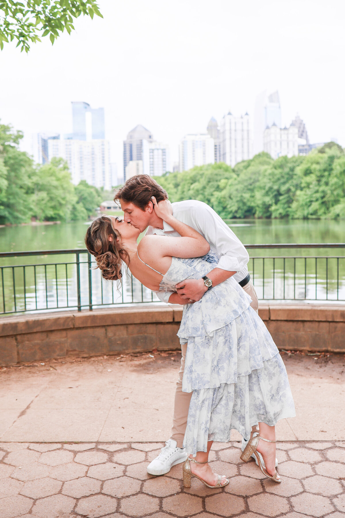 engaged couple kissing in Piedmont Park in Atlanta Georgia by Amanda Richardson Photography